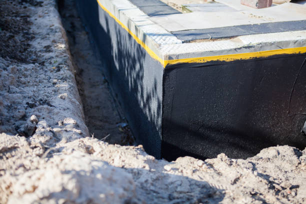Professional Basement Waterproofing technician working in West Chicago, IL